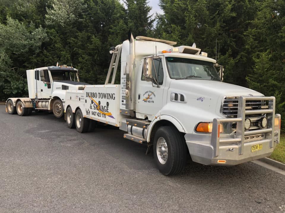 Two Towing Truck With Trees Background — Towing Service In Coonabarabran, NSW