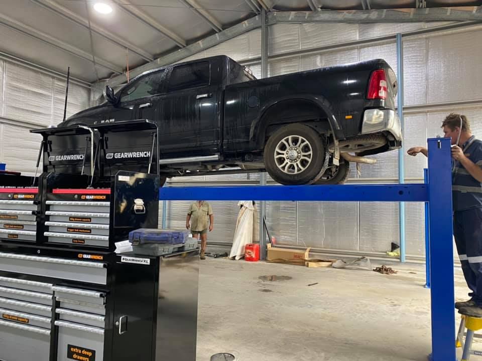 Pick Up On Car Lift In Workshop — Towing Service In Coonabarabran, NSW