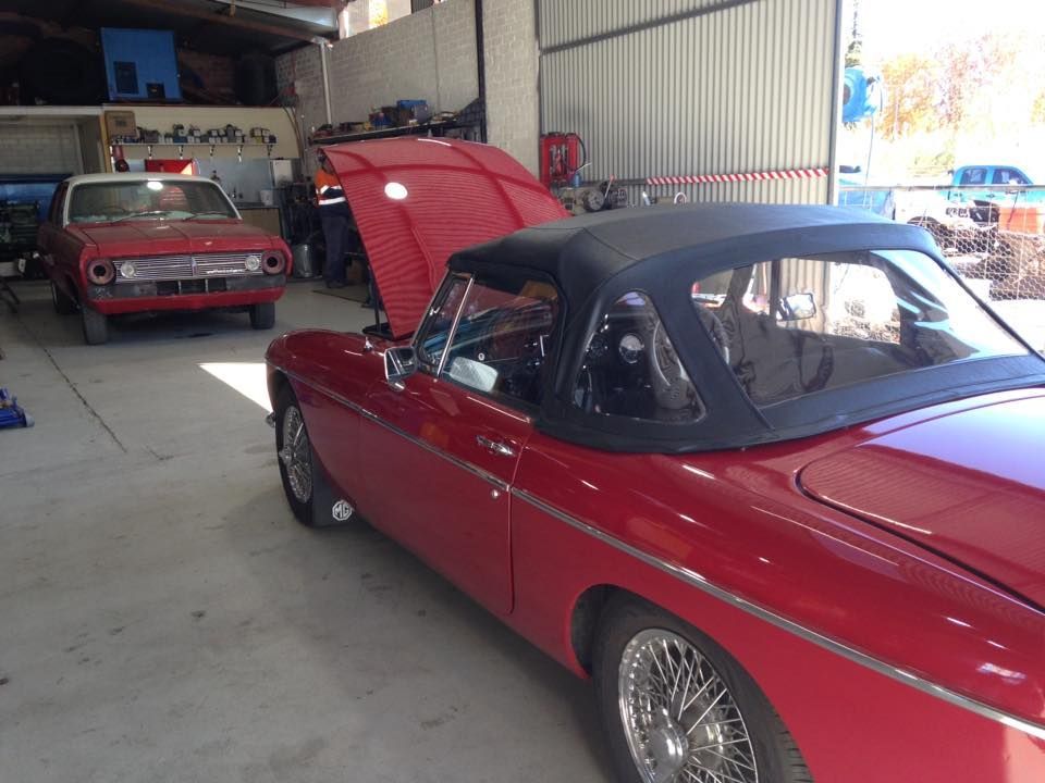 Red Car With Open Hood In Workshop — Towing Service In Coonabarabran, NSW