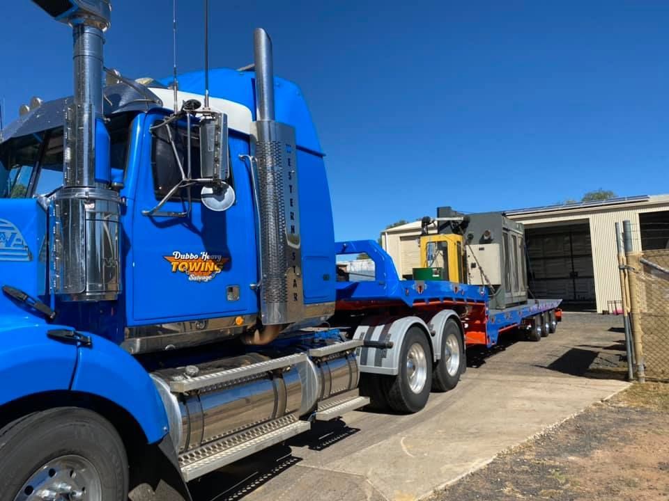 Machine Loaded Onto Towing Truck — Towing Service In Cobar, NSW