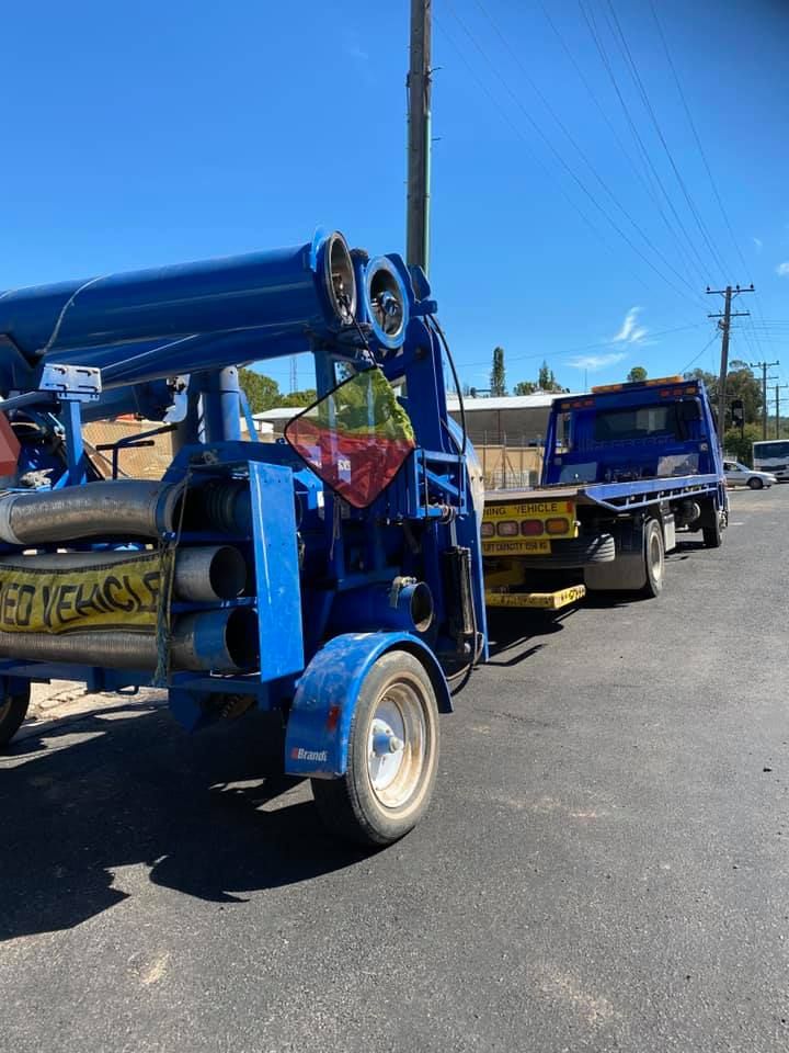 Blue Tow Truck On Road — Towing Service In Nyngan, NSW