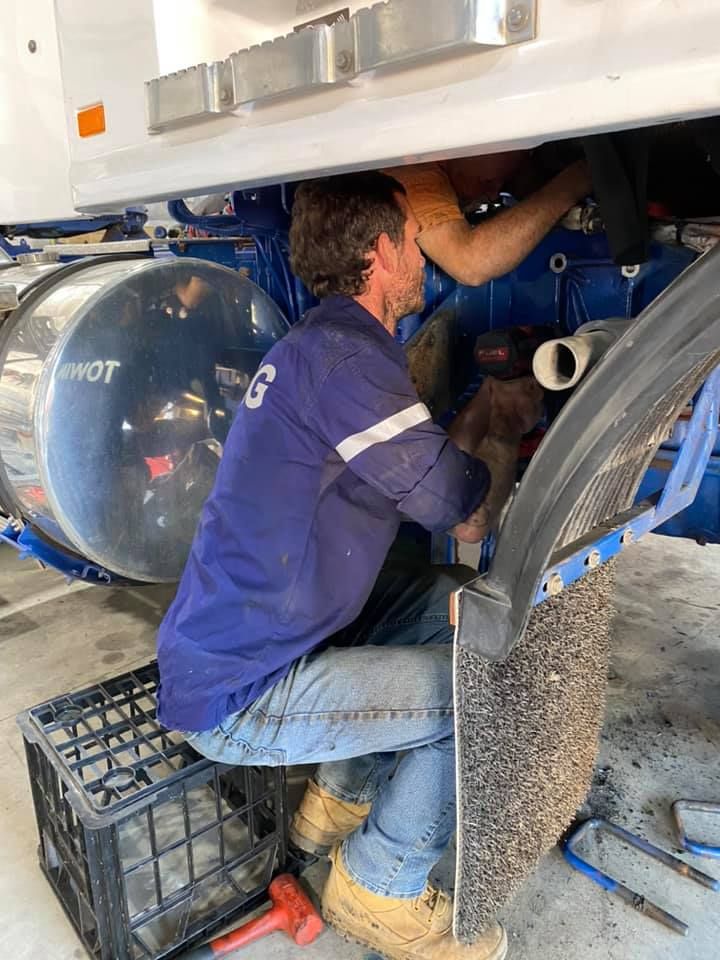 Two Men Repairing Under The Truck — Towing Service In Coonabarabran, NSW