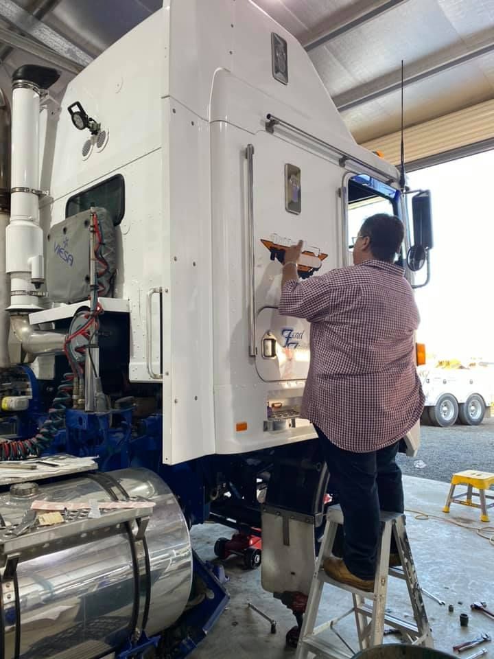 Man Standing Beside The Big Truck — Towing Service In Gilgandra, NSW