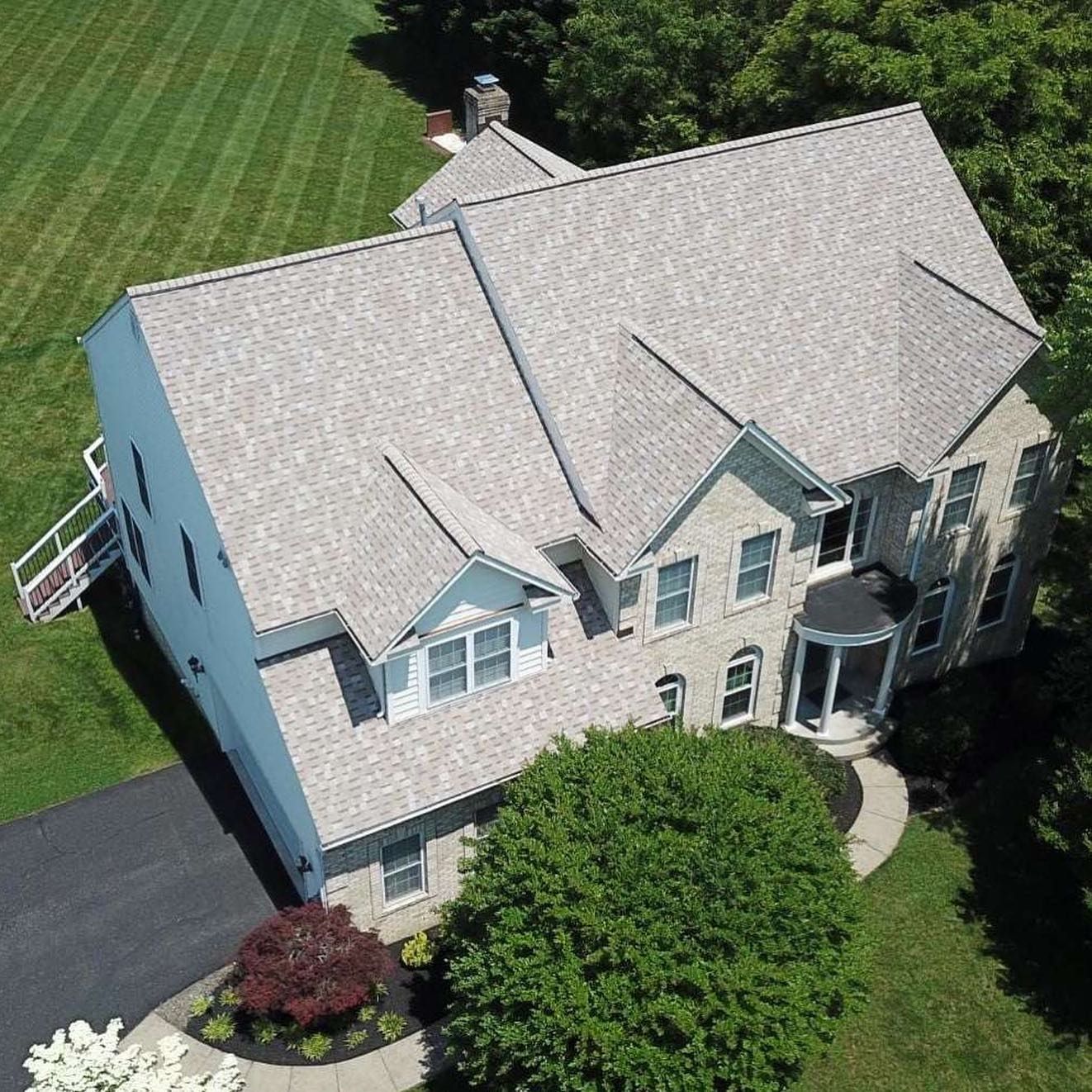 Large Home in Maryland with a new roof installation by Four Seasons Roofing