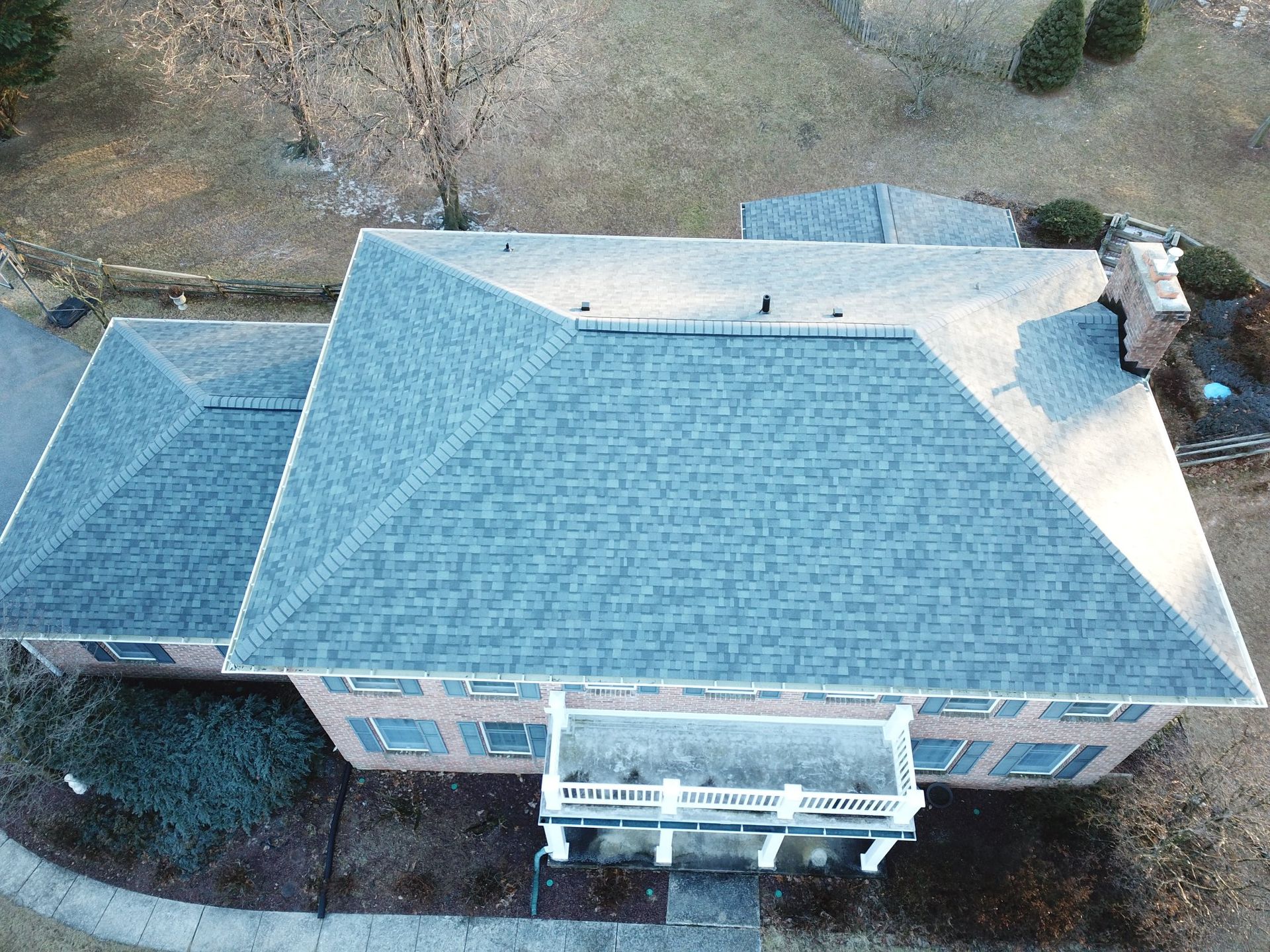 Old colonial home with a new roof replacement by Four Seasons Roofing a local roofer in Maryland