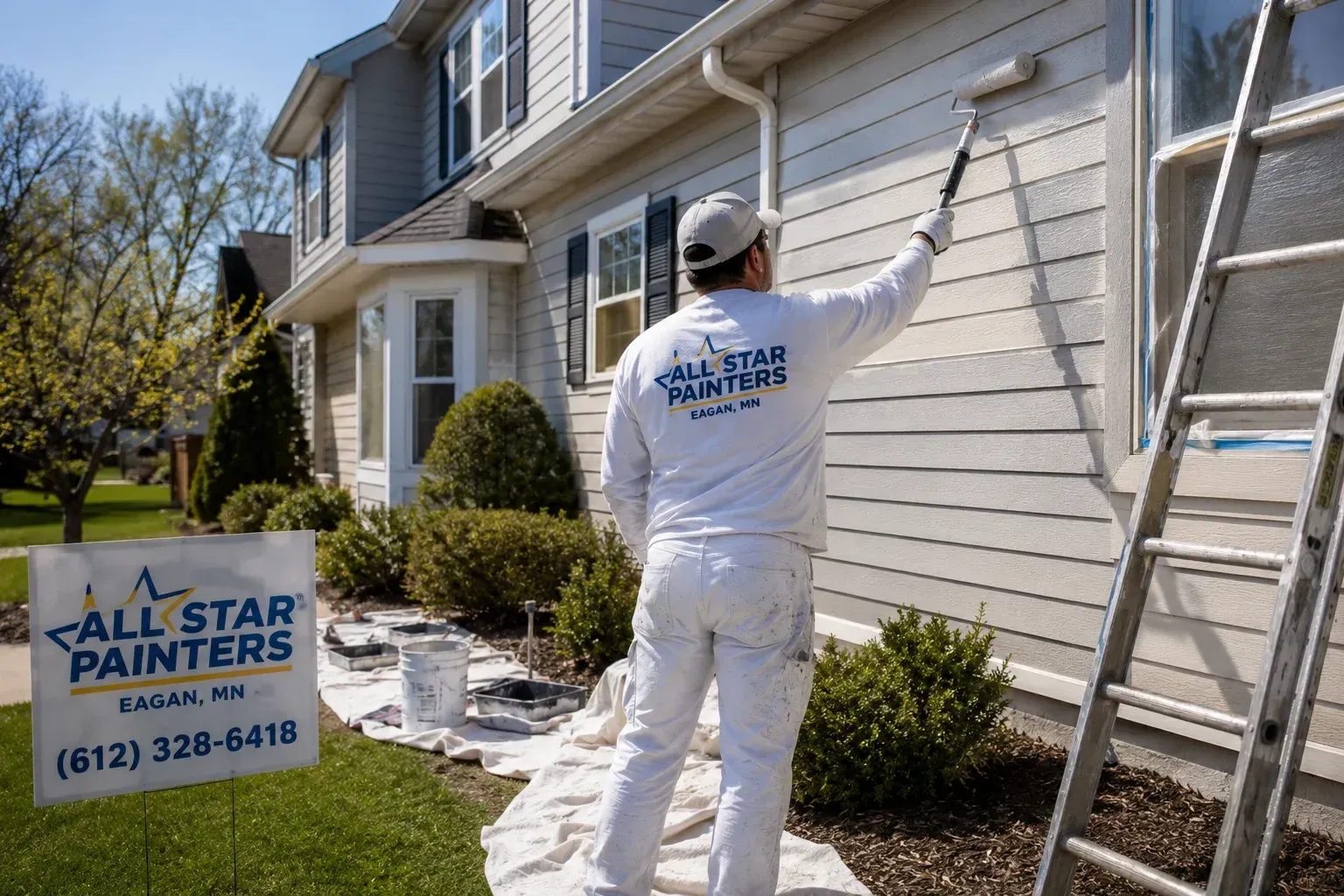 Painter on a ladder beside Eagan, MN exterior house painting text.