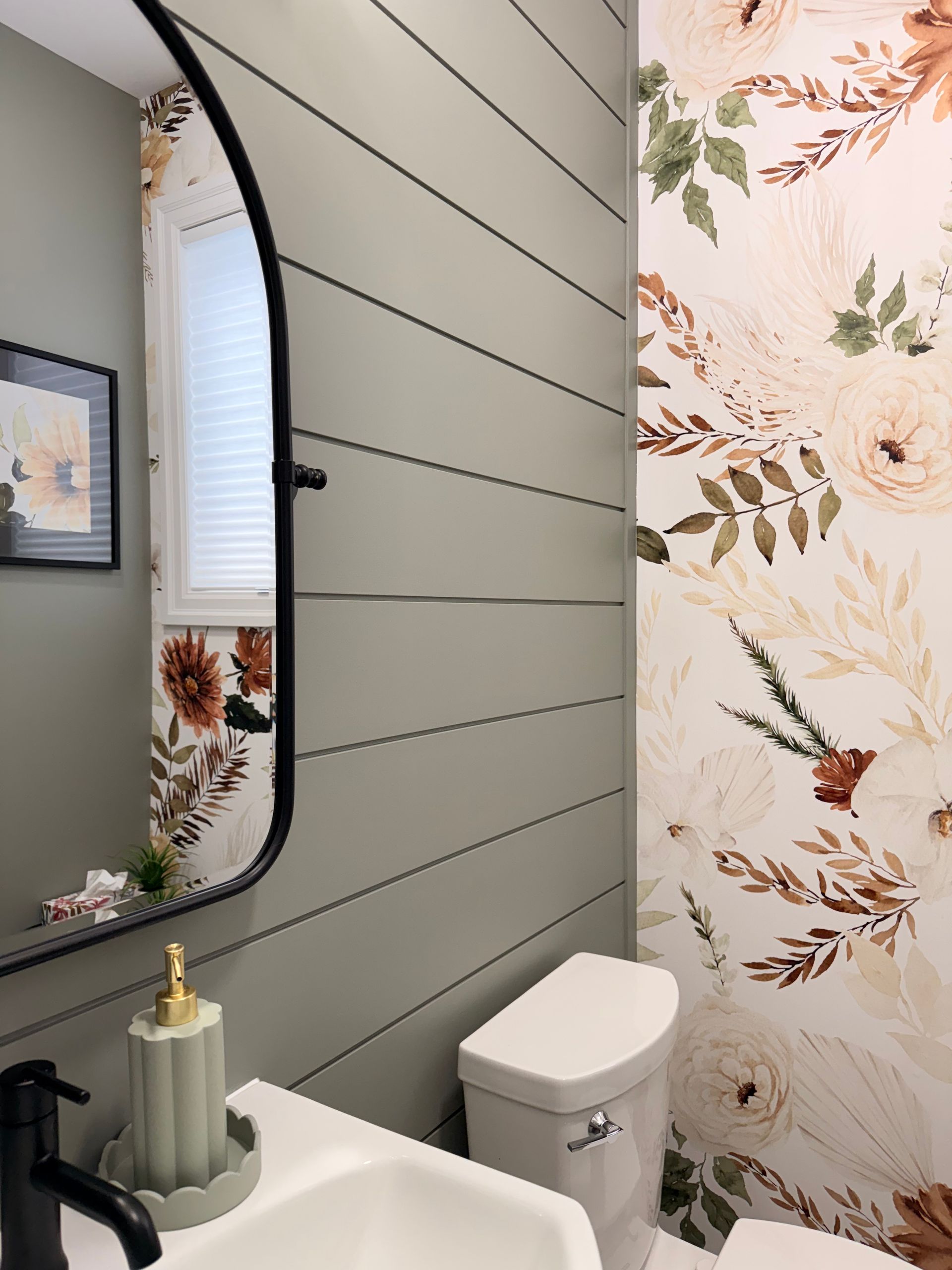 Custom accent wall with panel detailing and floral wallpaper
