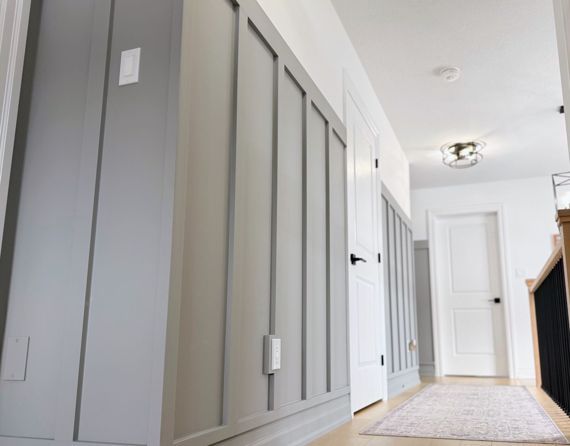 Vertical panel accent wall in a modern hallway