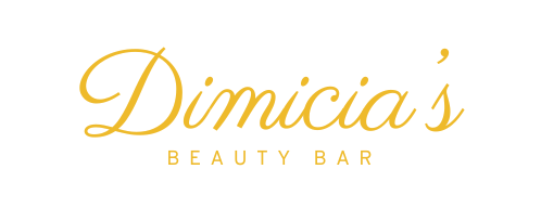 A gold logo for dimica 's beauty bar on a white background.