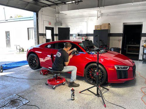Man detailing Audi R8