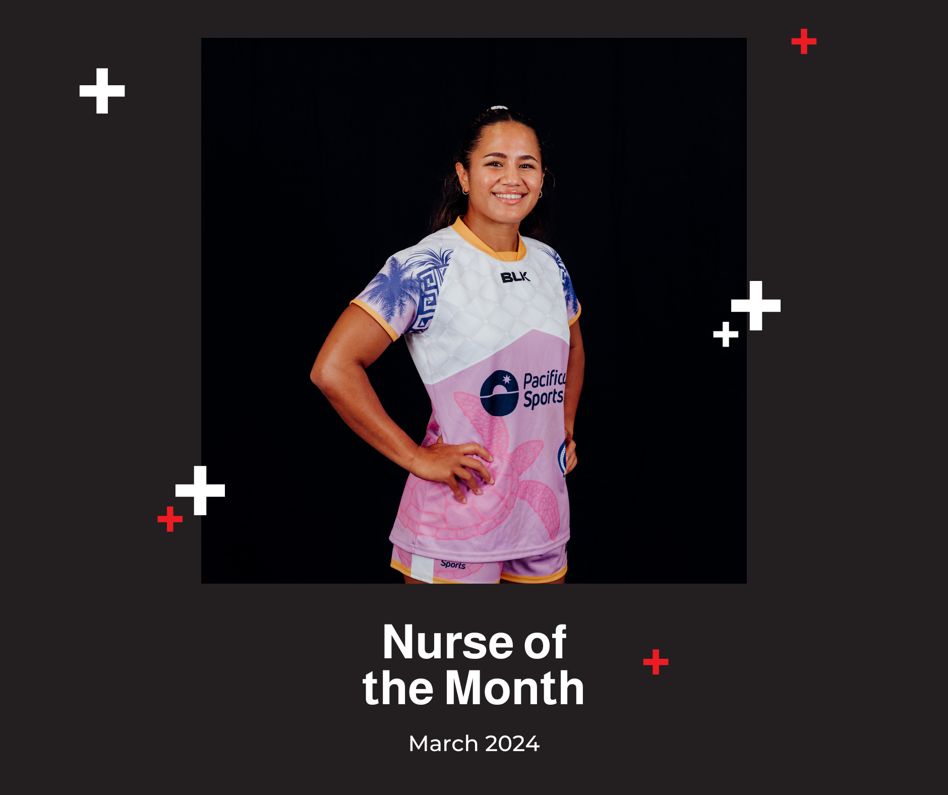 A woman in a pink and white shirt is nurse of the month