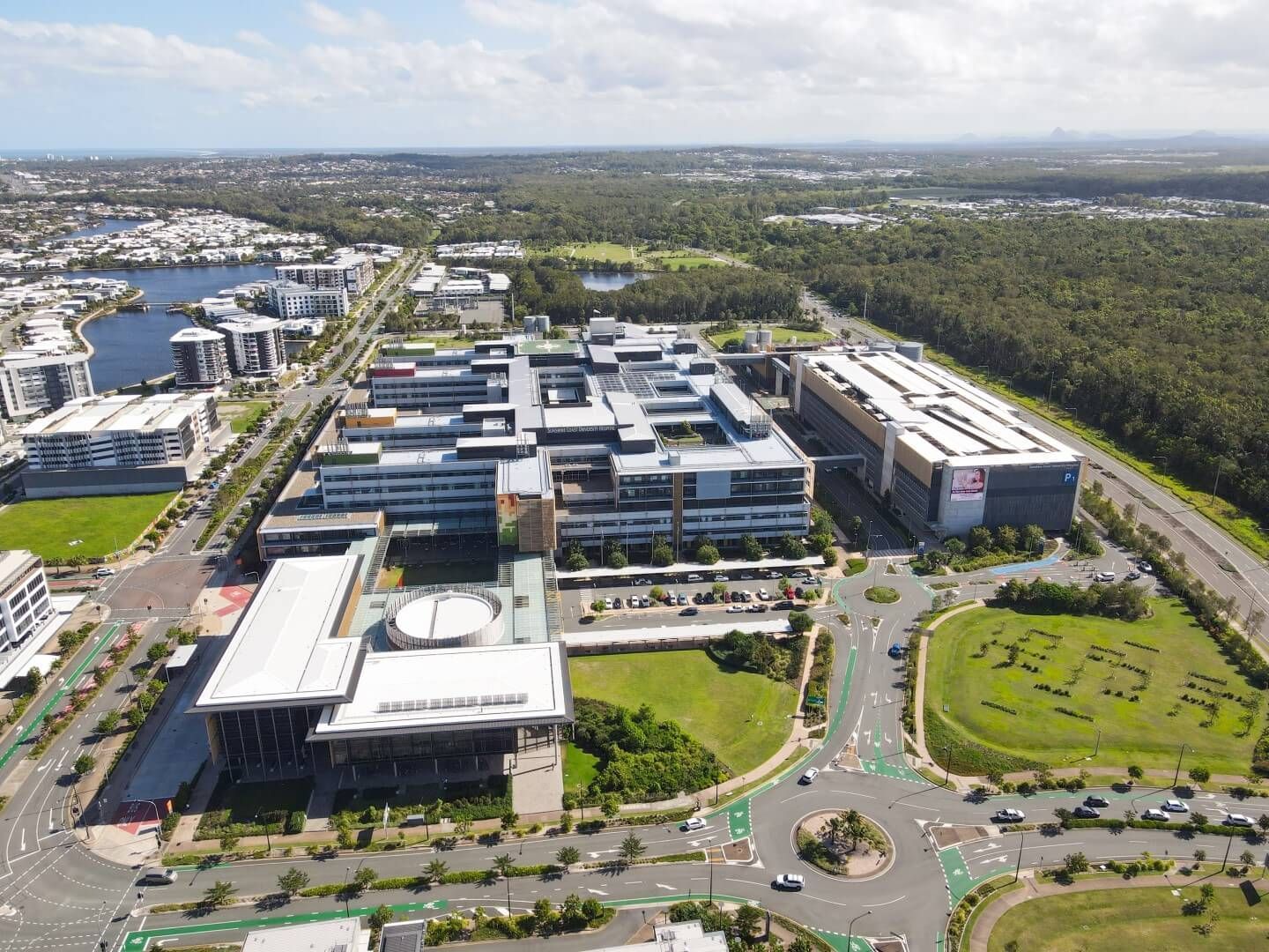 An aerial view of a city with lots of buildings and trees.