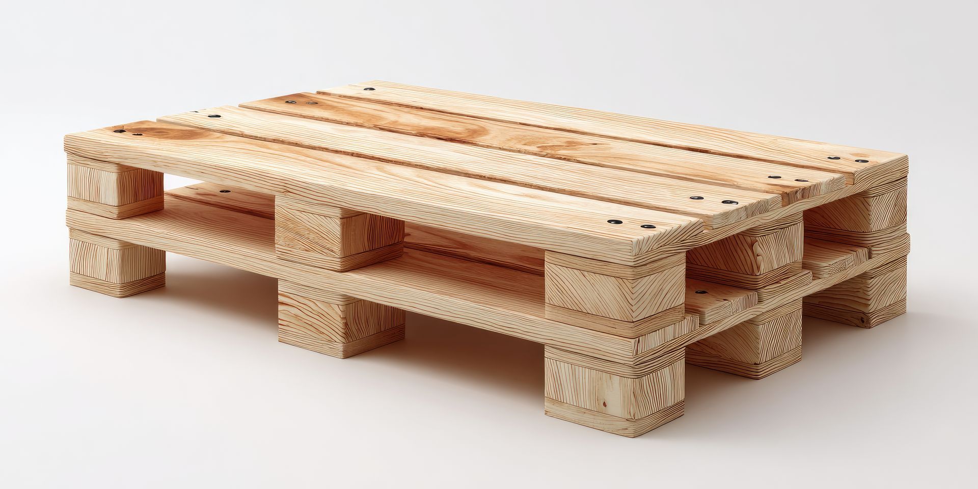 A wooden pallet is sitting on a white surface. A wooden pallet is sitting on a white surface.