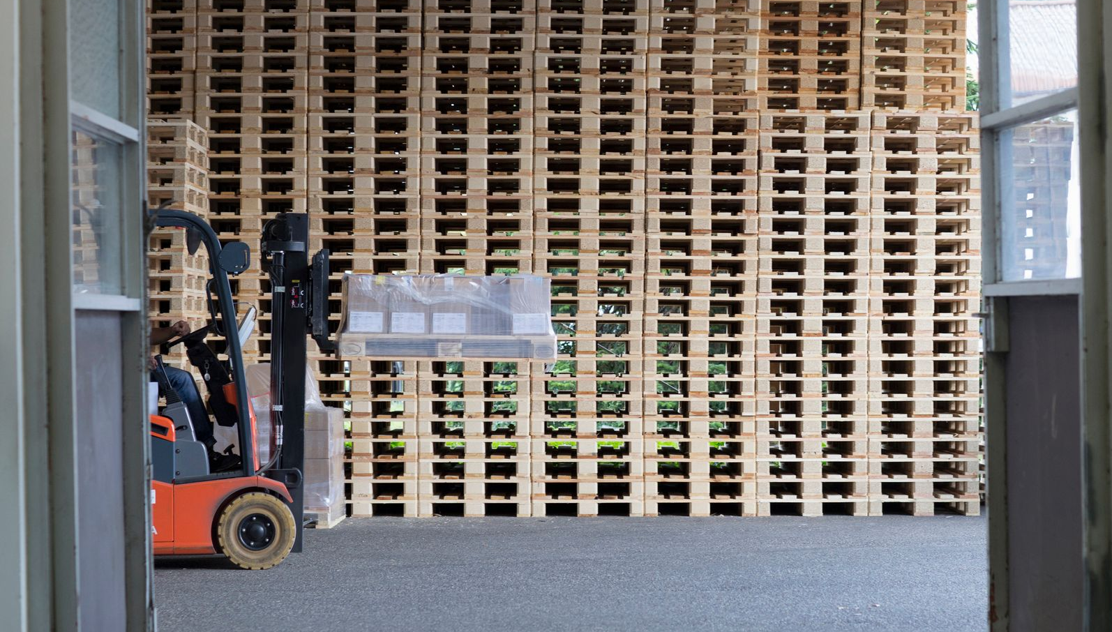 A stack of wooden pallets stacked on top of each other.