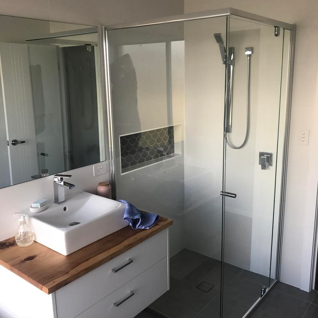 A Bathroom With a Sink, Mirror and Shower — Swift Glass & Aluminium In Grafton, NSW