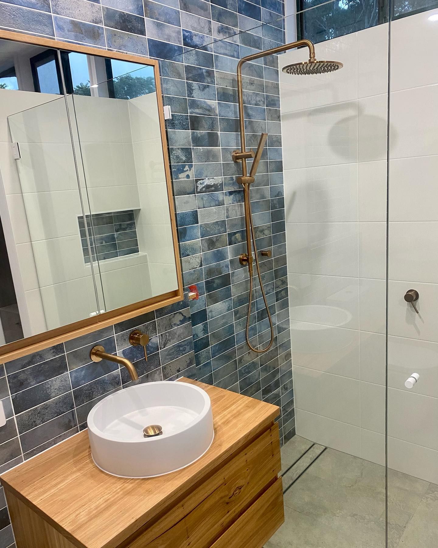 A Bathroom  With a Sink, Mirror and Shower — Swift Glass & Aluminium In Woolgoolga, NSW