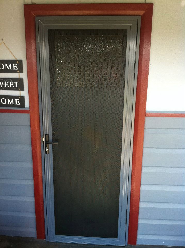 A Screen Door With a Welcome Sign Hanging Above It — Swift Glass & Aluminium In Valla, NSW