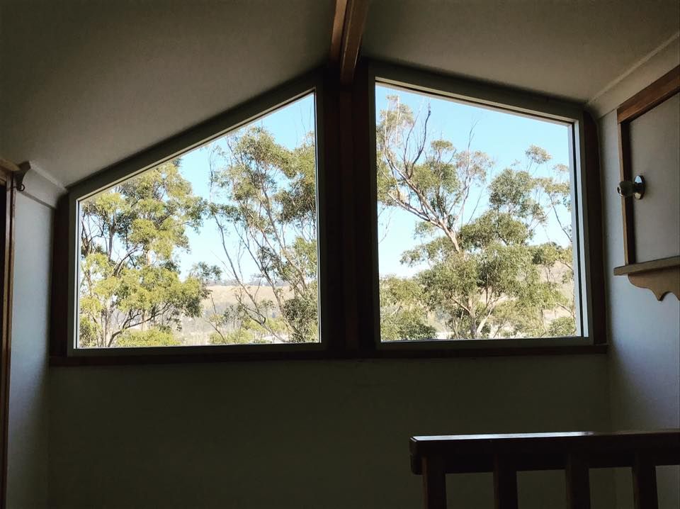 A Window With a View of Trees and a Blue Sky — Swift Glass & Aluminium In Grafton, NSW
