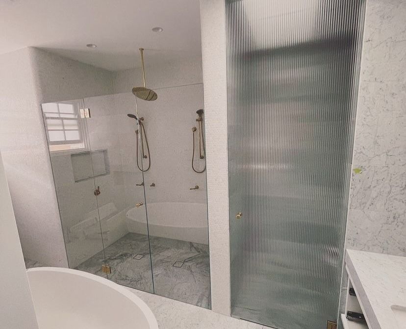 A Bathroom With a Bathtub, Shower, and Sink — Swift Glass & Aluminium In Woolgoolga, NSW