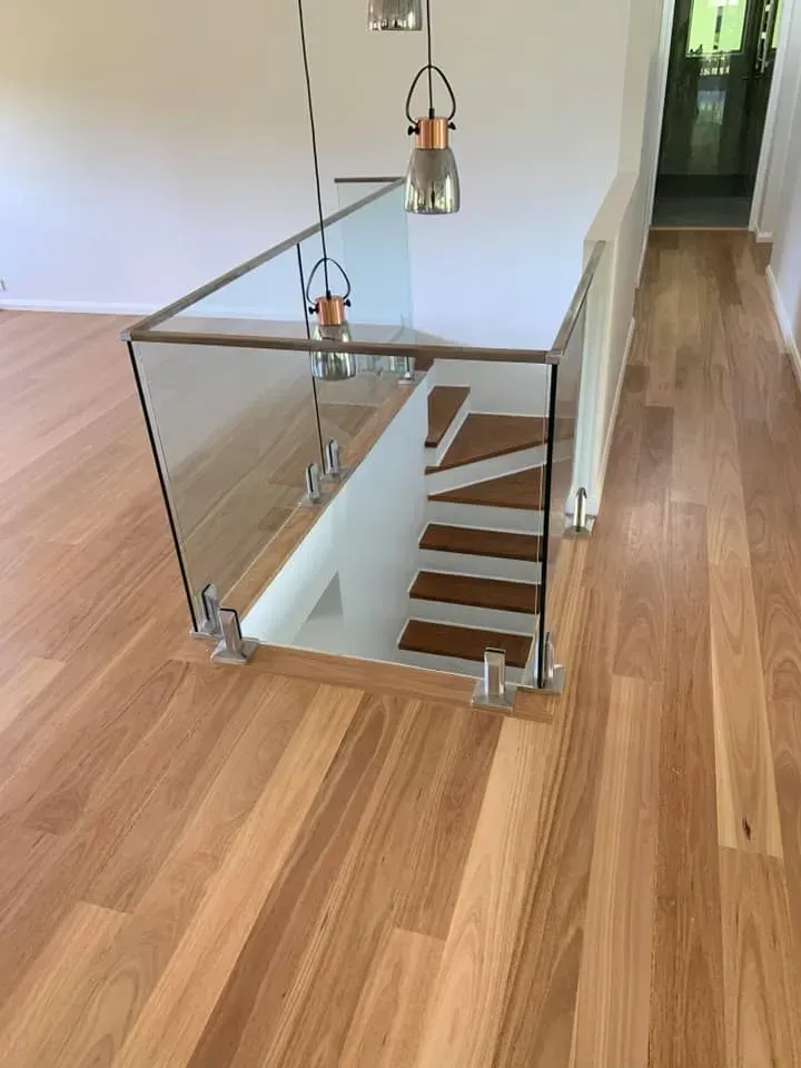 A Wooden Floor With a Glass Railing and Stairs β Swift Glass & Aluminium In Woolgoolga, NSW