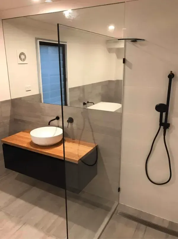 A Bathroom With a Sink, Shower and Mirror β Swift Glass & Aluminium In Woolgoolga, NSW