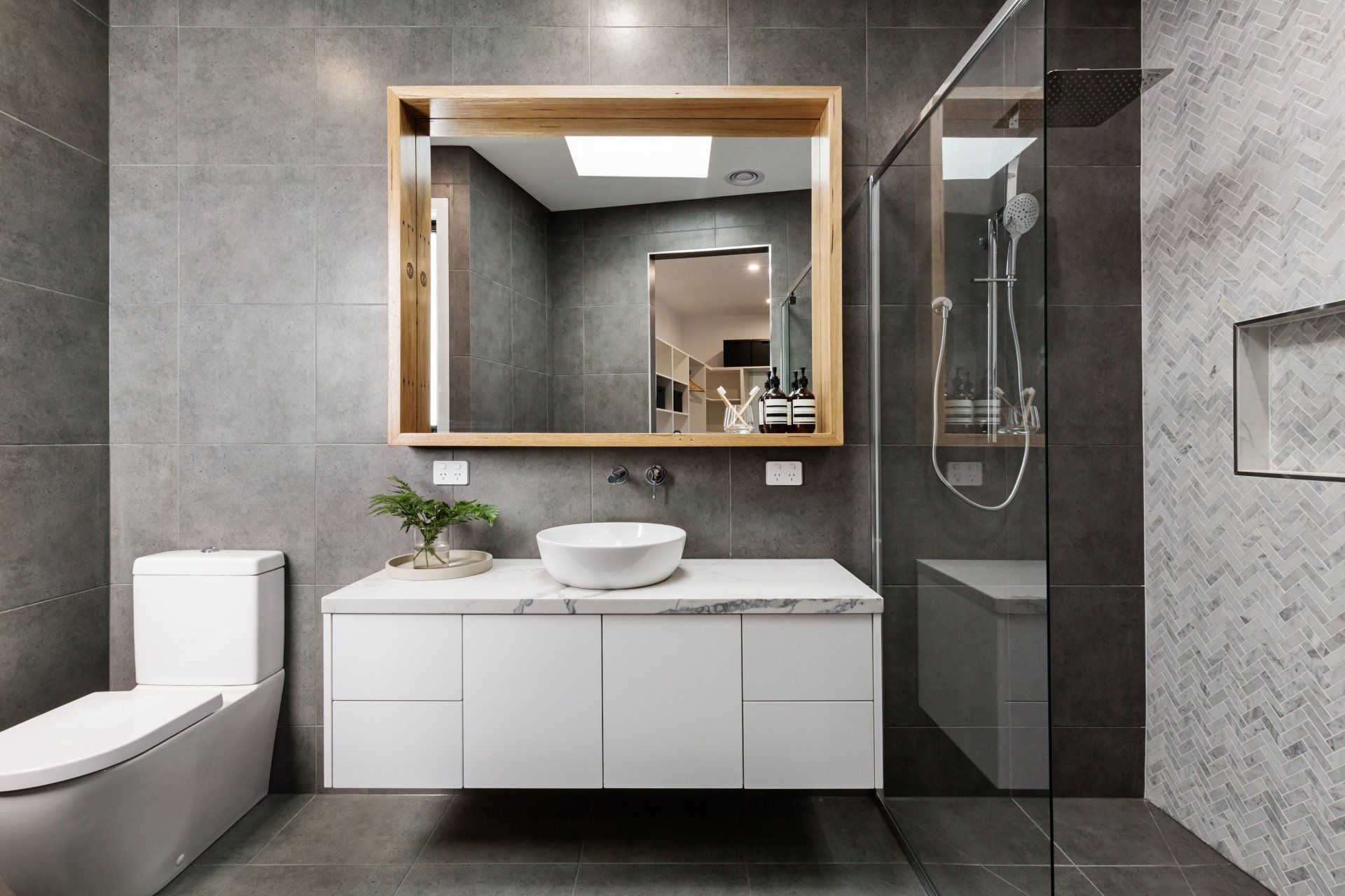 A Bathroom With a Toilet, Sink, Mirror and Walk in Shower — Swift Glass & Aluminium In Woolgoolga, NSW