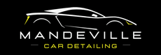 A logo for mandeville car detailing with a yellow car on it.