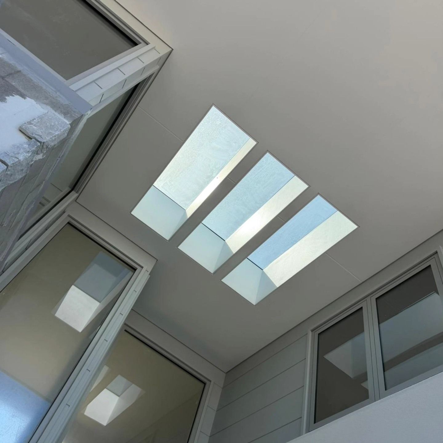 Skylights in a White Ceiling Above Windows in an Interior Space โ All Coast Painting in Tweed Heads South, NSW