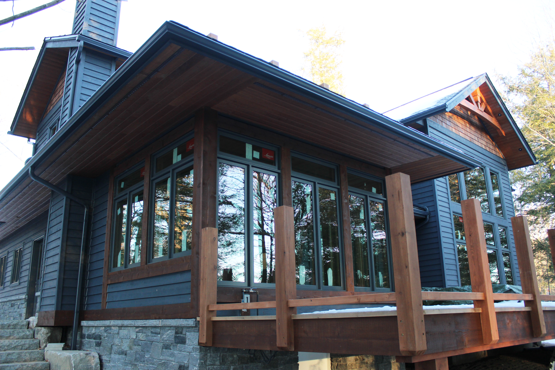 Corner view of a cottage with emphasis on the Muskoka Room.