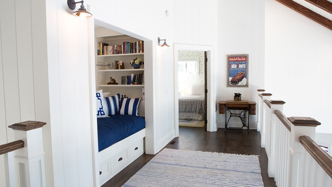 Upper hallway in a cottage showing a side reading room for the kids.