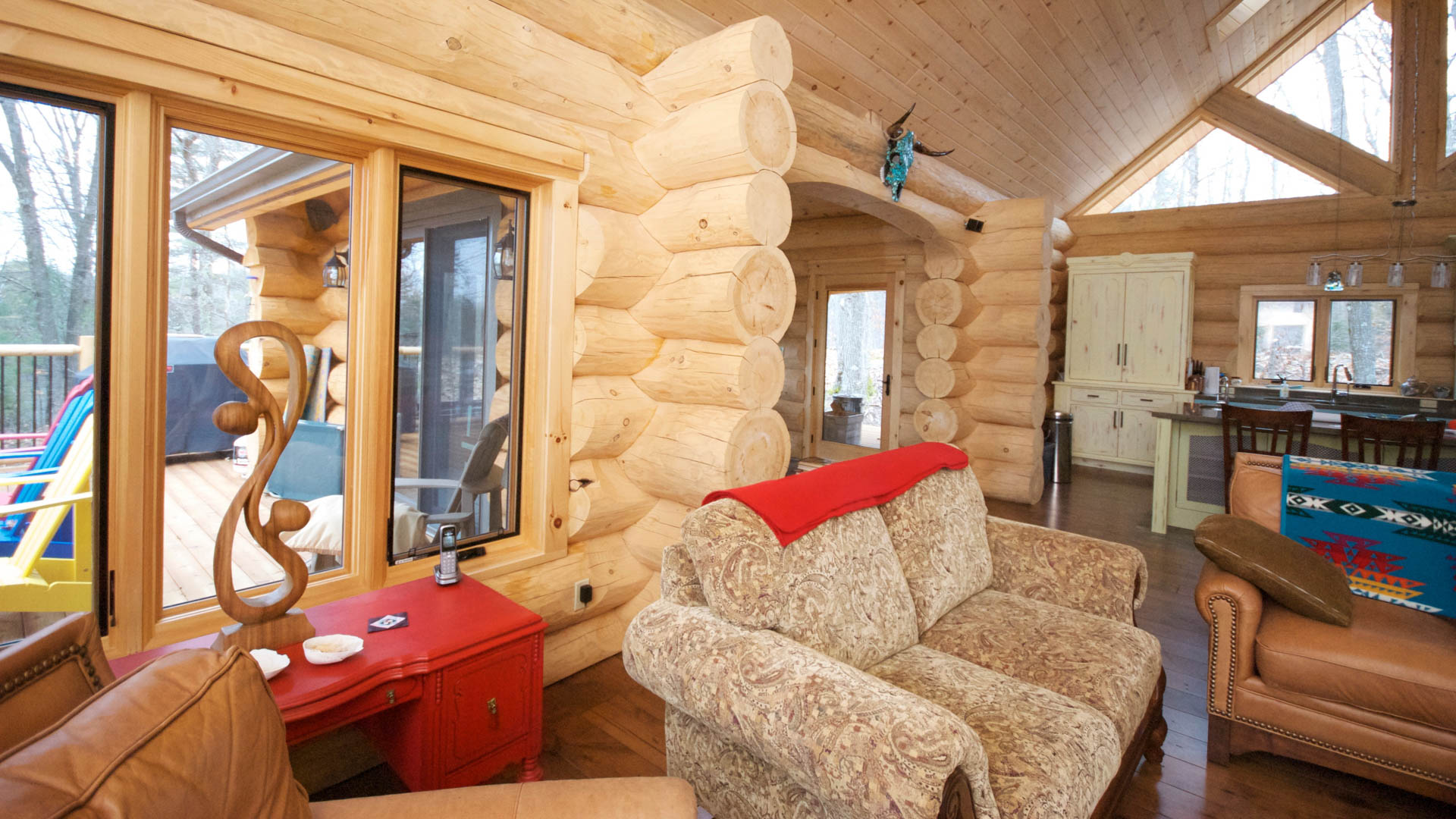 Inside the uncompleted Muskoka Room showing wood ceilings, floors and  window fixtures.