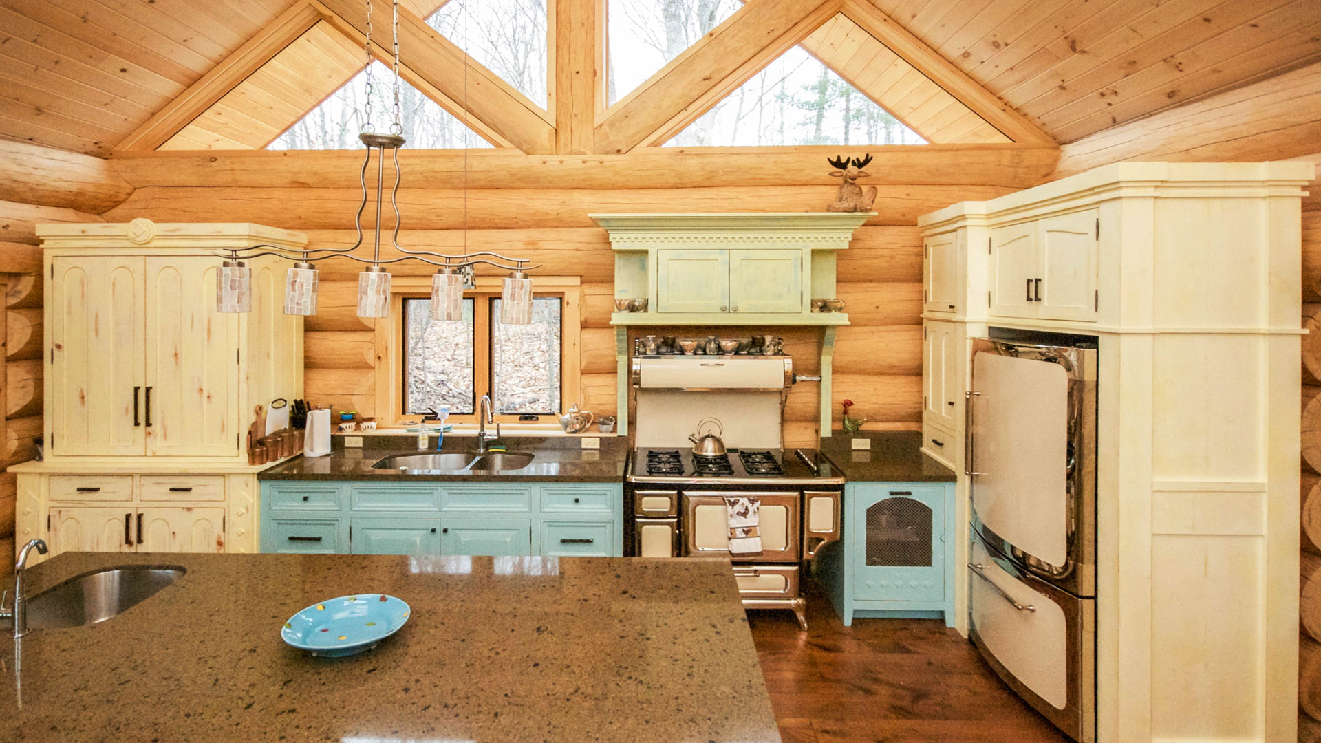 Almost finished kitchen showing ceiling beams and ample counter space.