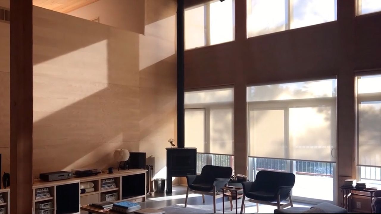 Brightly lit lliving room in modern, japandi style.