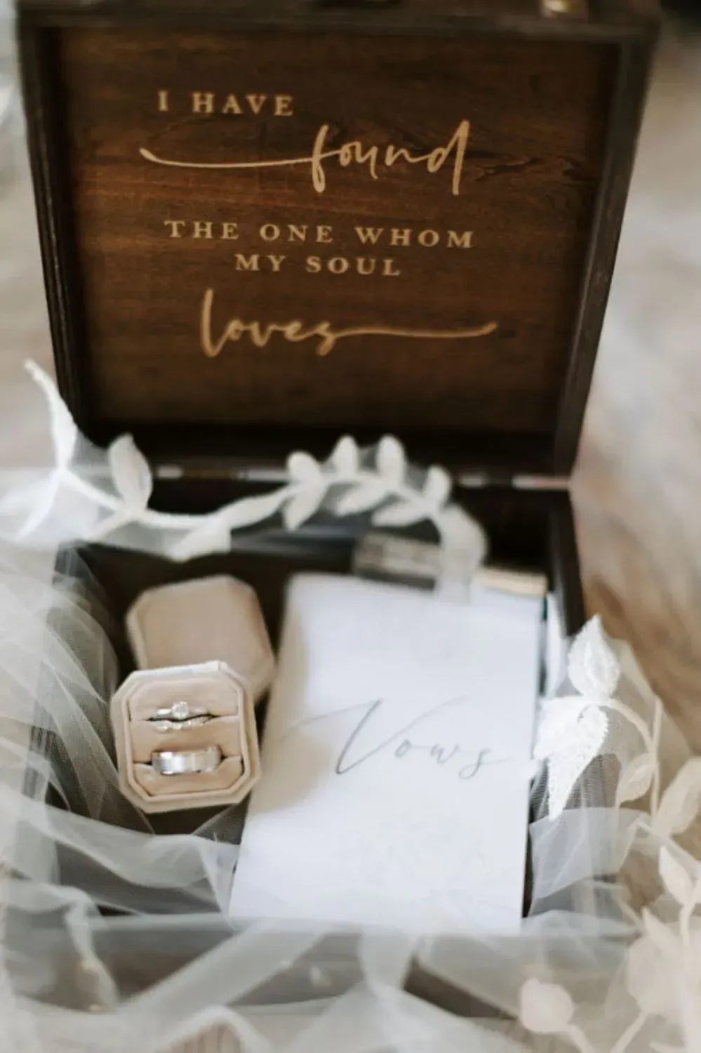 Display of wedding invitation and wedding rings.
