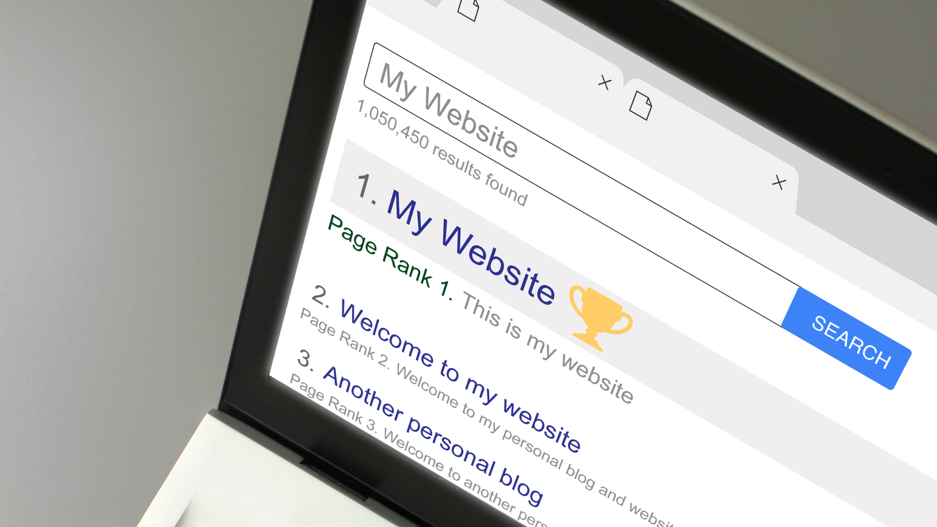 A laptop is open to a page that says my website