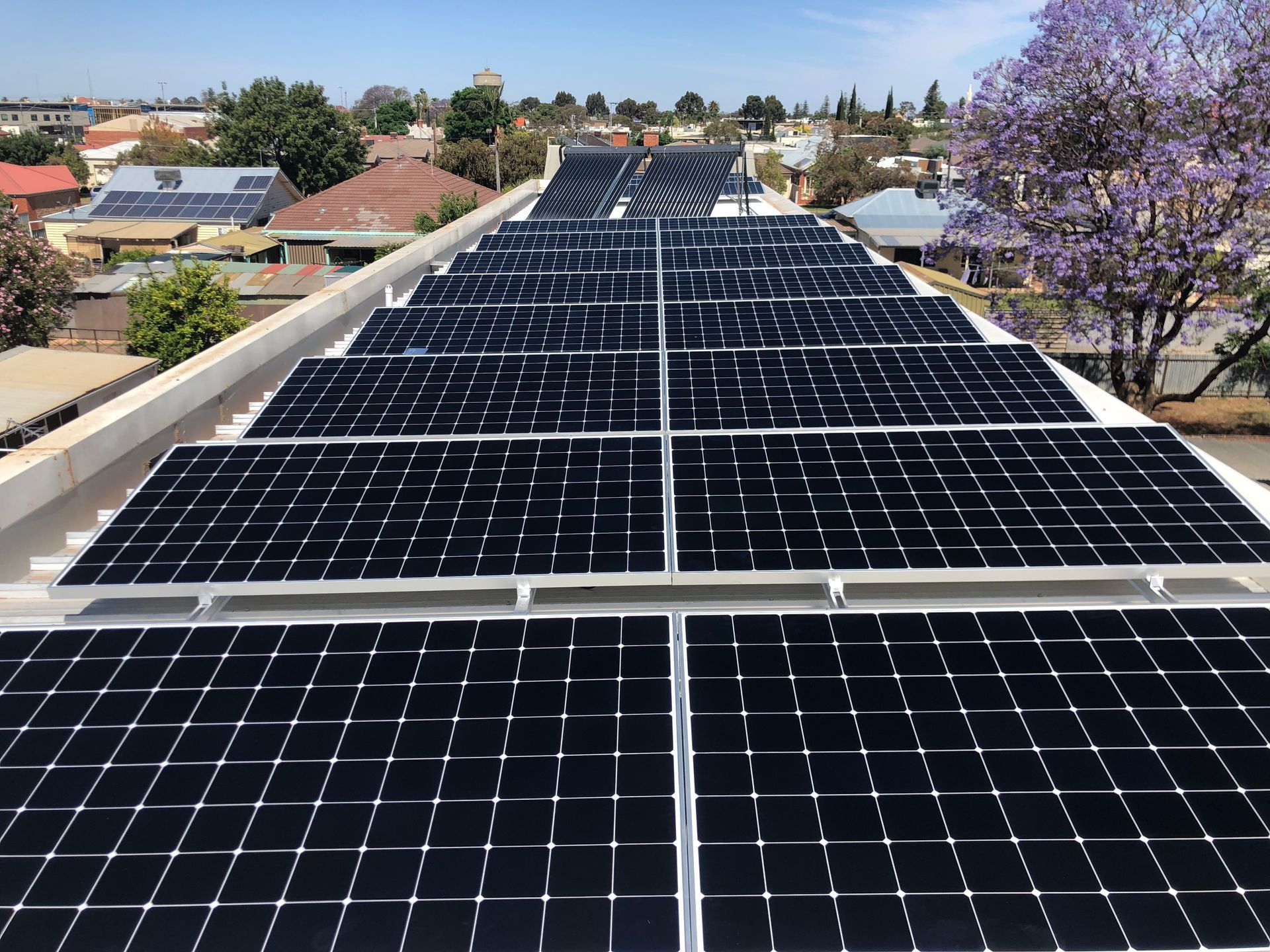 A House with Solar Panels on The Roof and A Blue Sky in The Background | Mildura, VIC | Mildura Solar