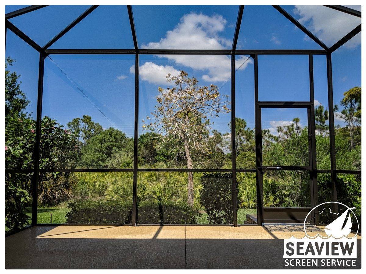 A screened in porch with seaview screen service written on the bottom