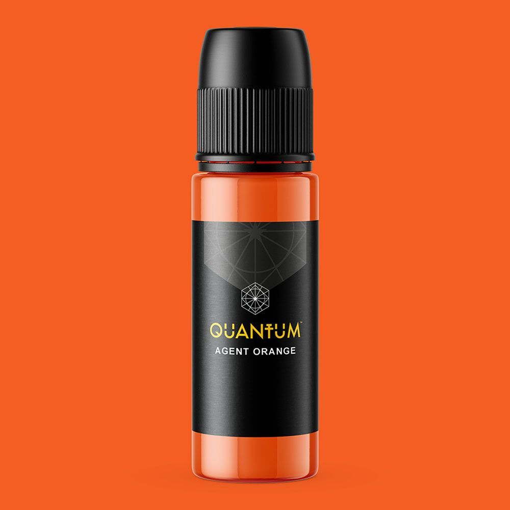 A small bottle of Quantum Agent Orange tattoo ink with a black cap and label, set against a solid orange background.