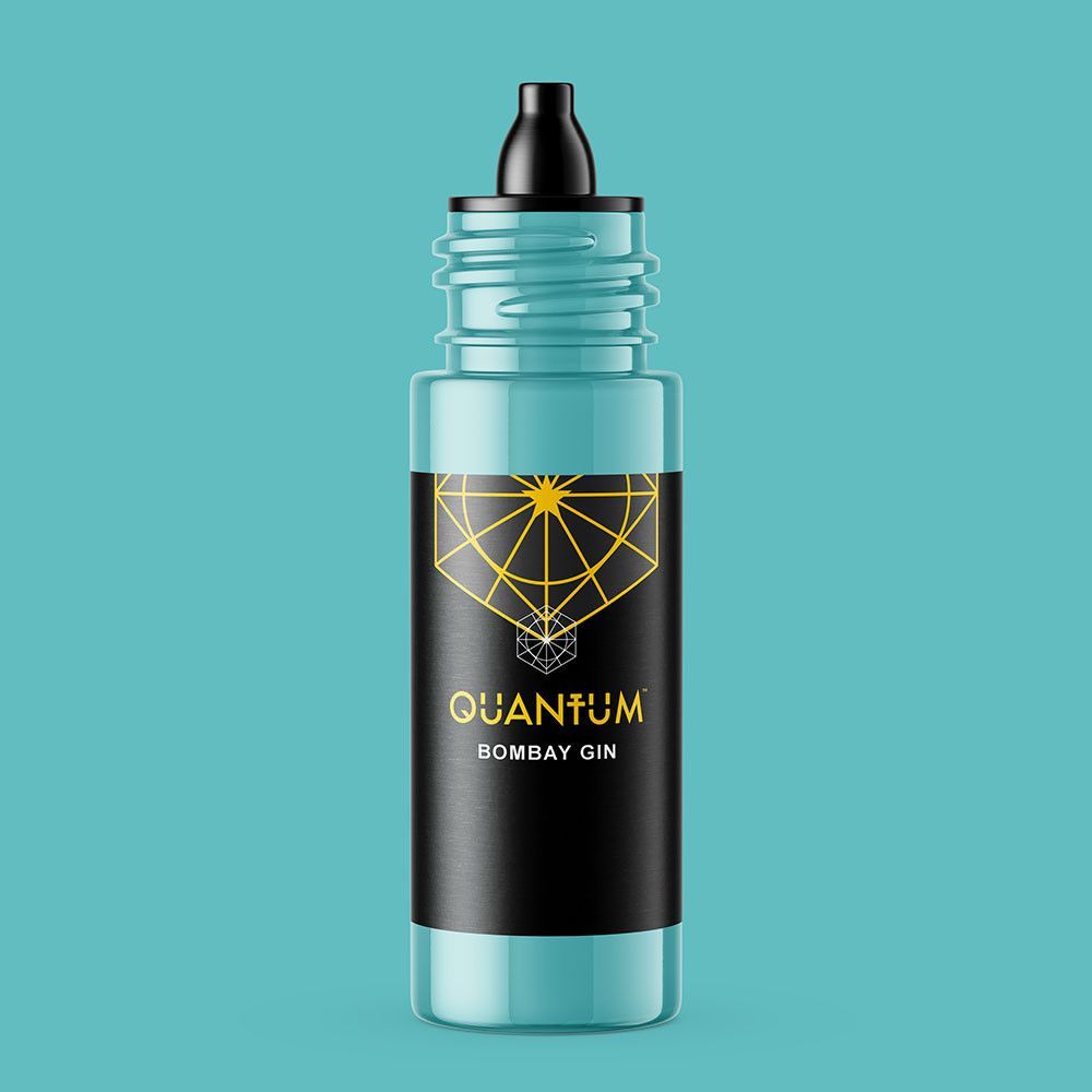 A teal-colored bottle of Quantum Bombay Gin tattoo ink with a black label and a geometric gold logo.