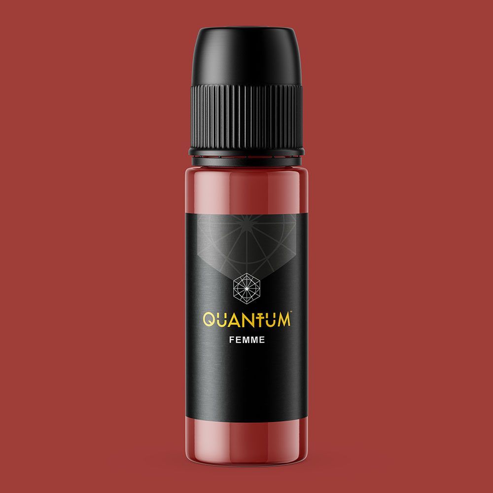 A small bottle of Quantum Femme pigment with a black cap and label, set against a matching terracotta background.
