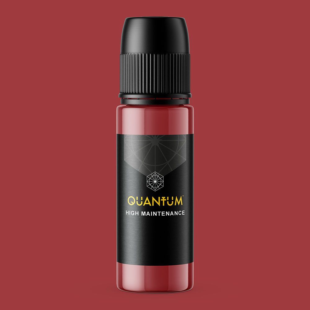 A small, cylindrical bottle of Quantum High Maintenance pigment with a black cap and dark red liquid contents.