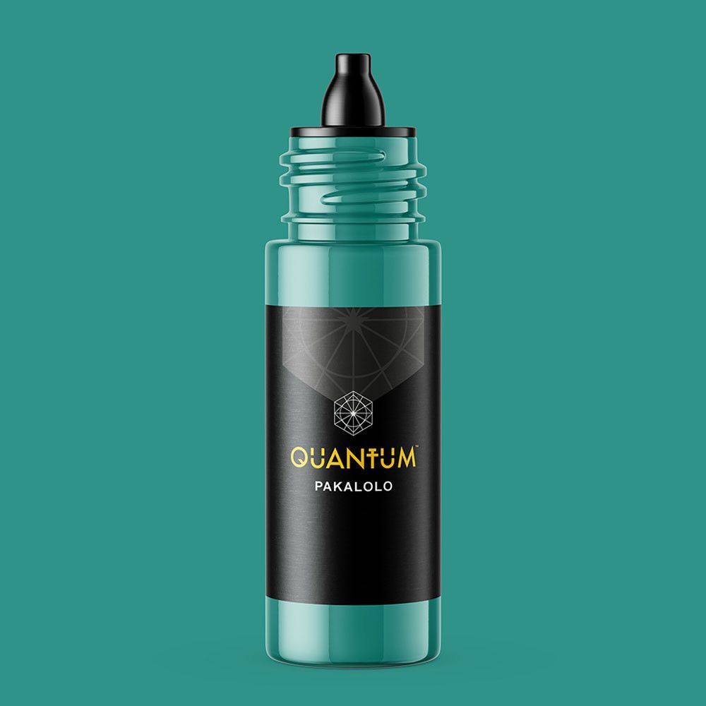 A teal-colored bottle of Quantum brand tattoo ink, labeled