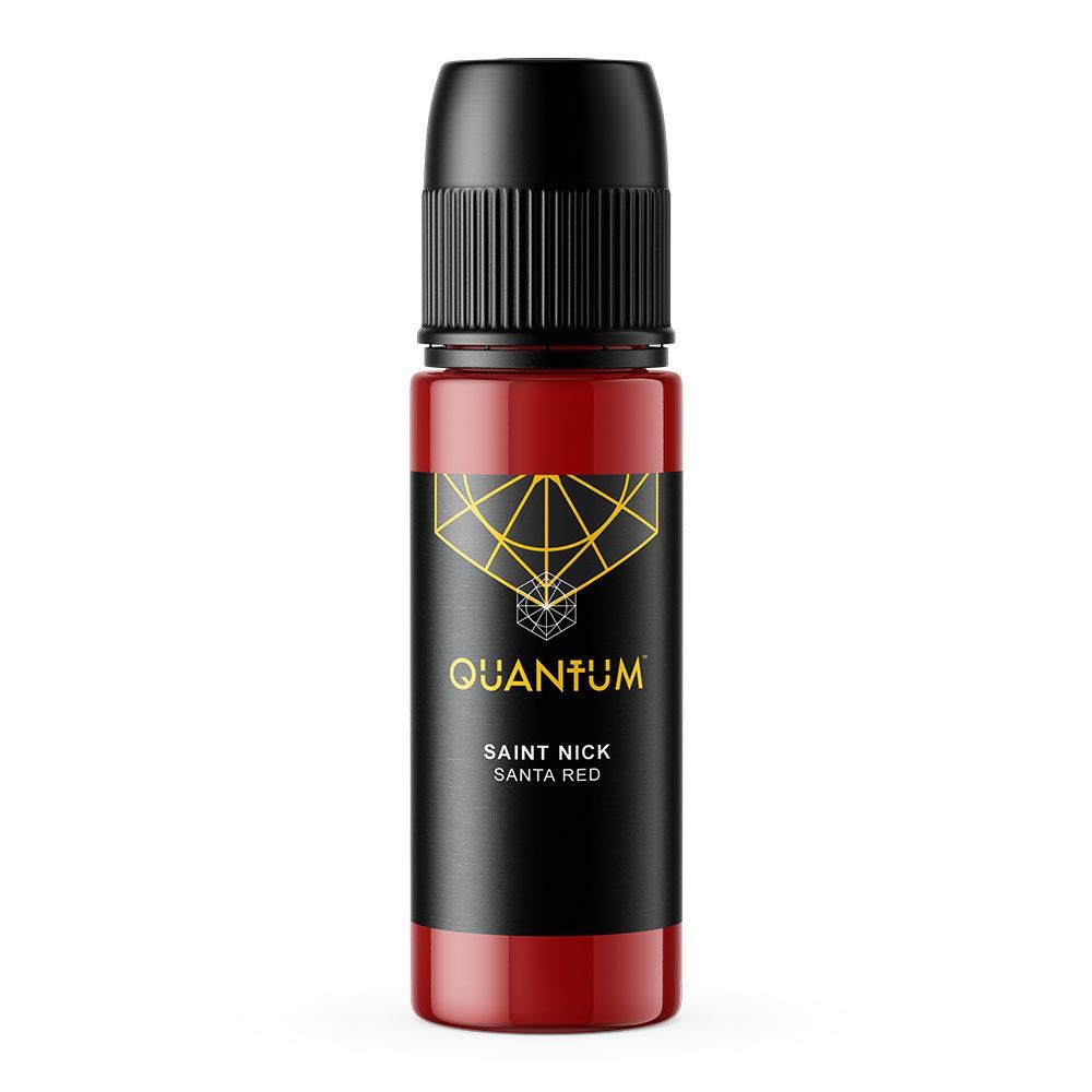 A bottle of Quantum Saint Nick red tattoo ink with a black label, centered against a solid red background.
