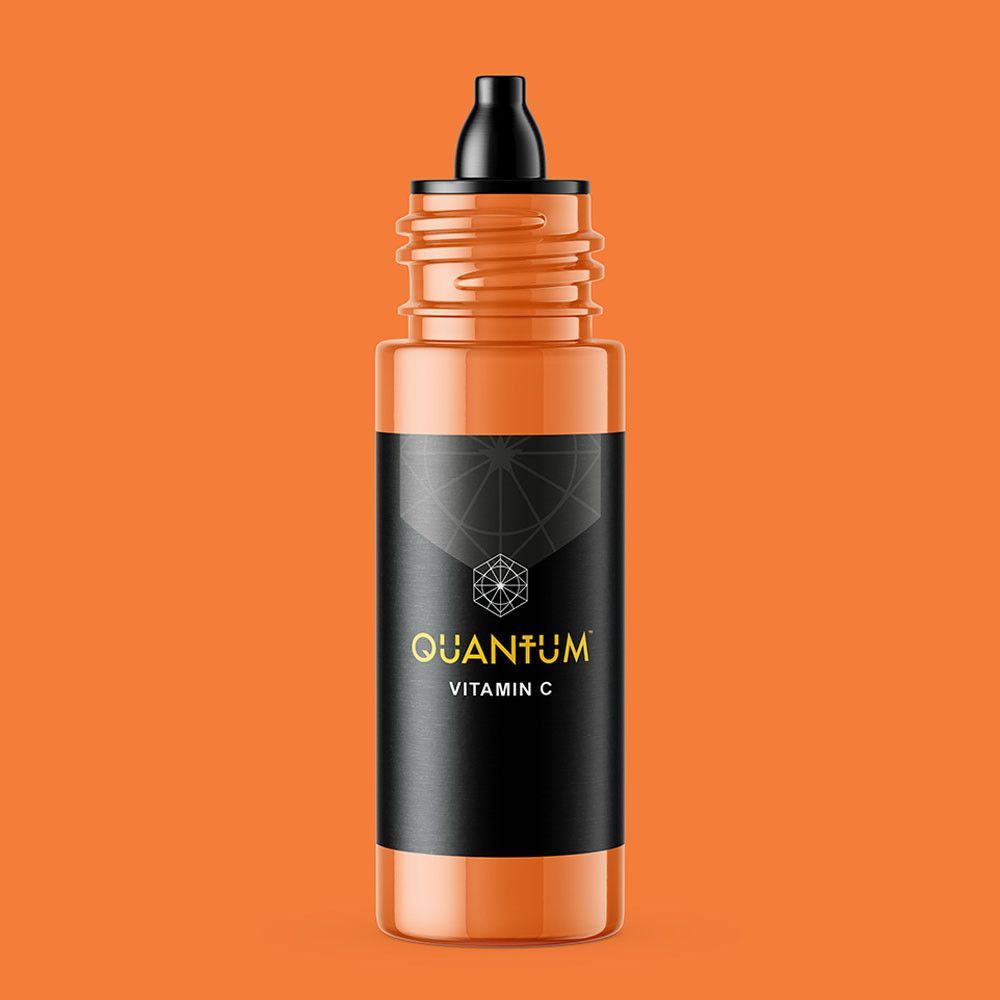 An orange dropper bottle of Quantum Vitamin C serum with a black label and black cap against a white background.
