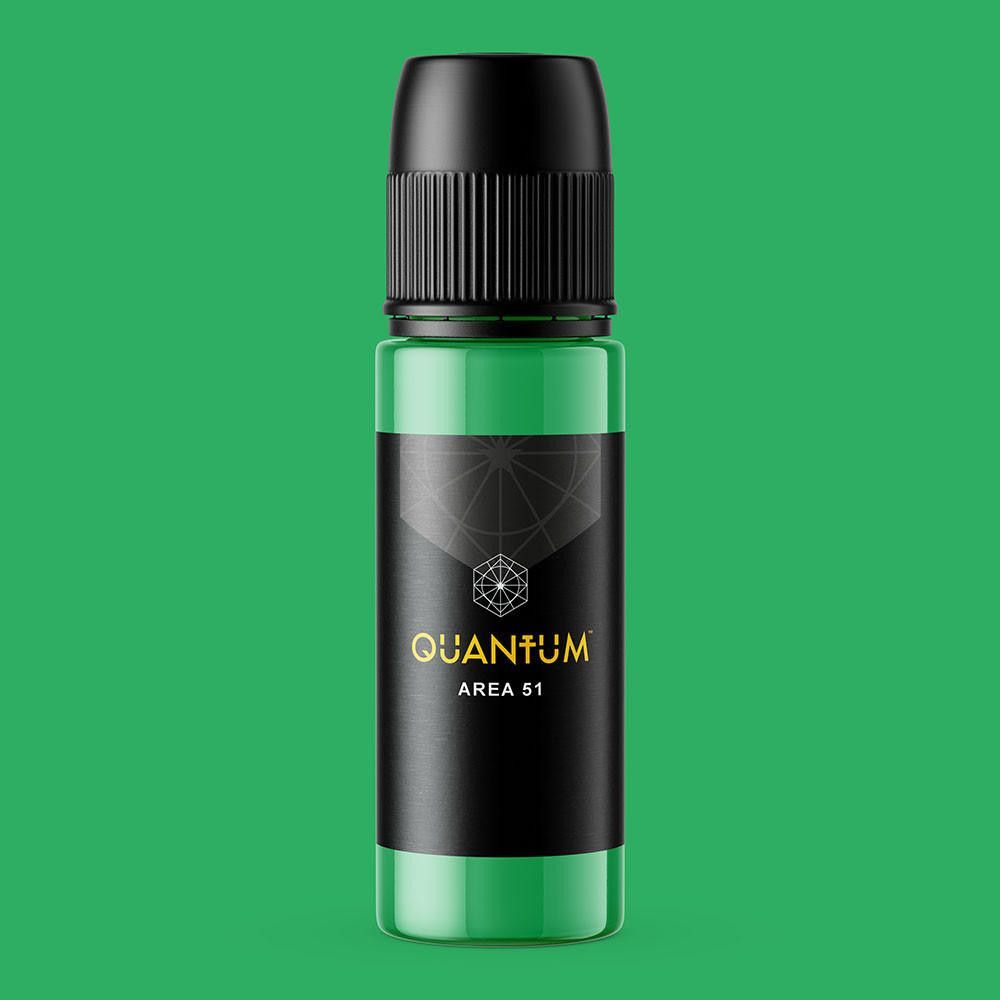 A green squeeze bottle of Quantum Area 51 tattoo ink with a black label on a white background.