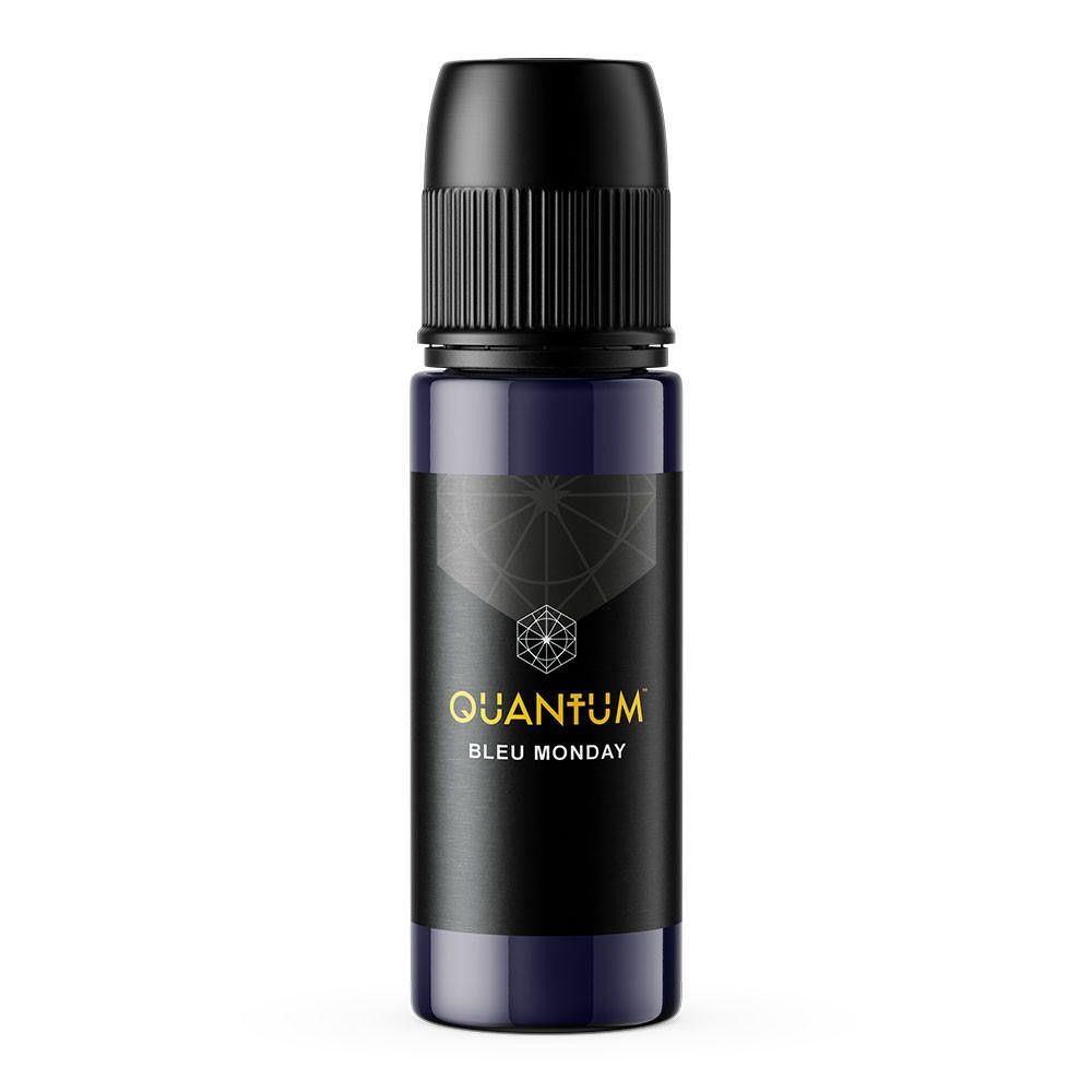 A small, dark blue bottle of Quantum Blue Monday essential oil or fragrance with a black screw-on cap.
