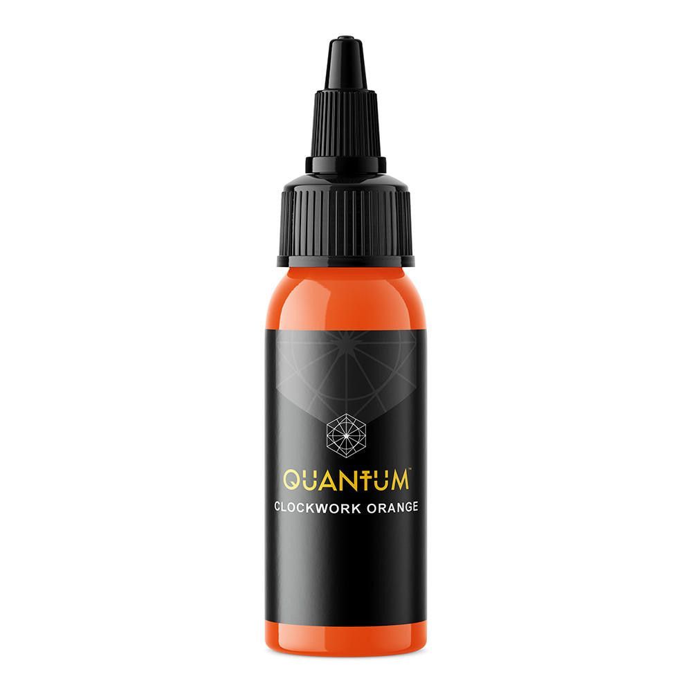 A bottle of bright orange tattoo ink labeled