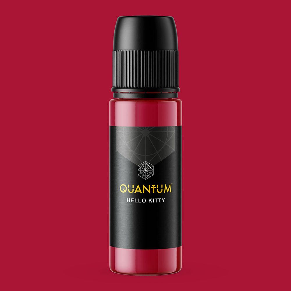 A bottle of Quantum brand Hello Kitty tattoo ink, featuring a deep red pigment and a black cap, set against a white background.