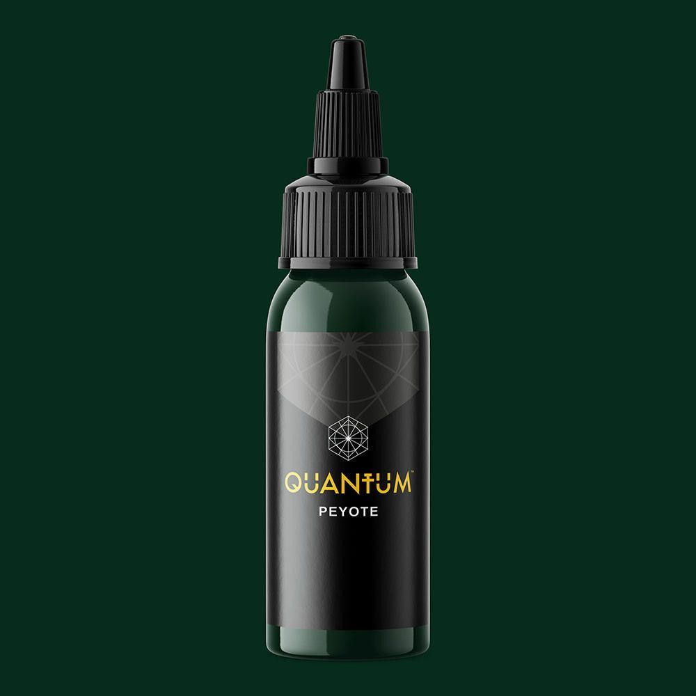 A dark green bottle of Quantum tattoo ink labeled