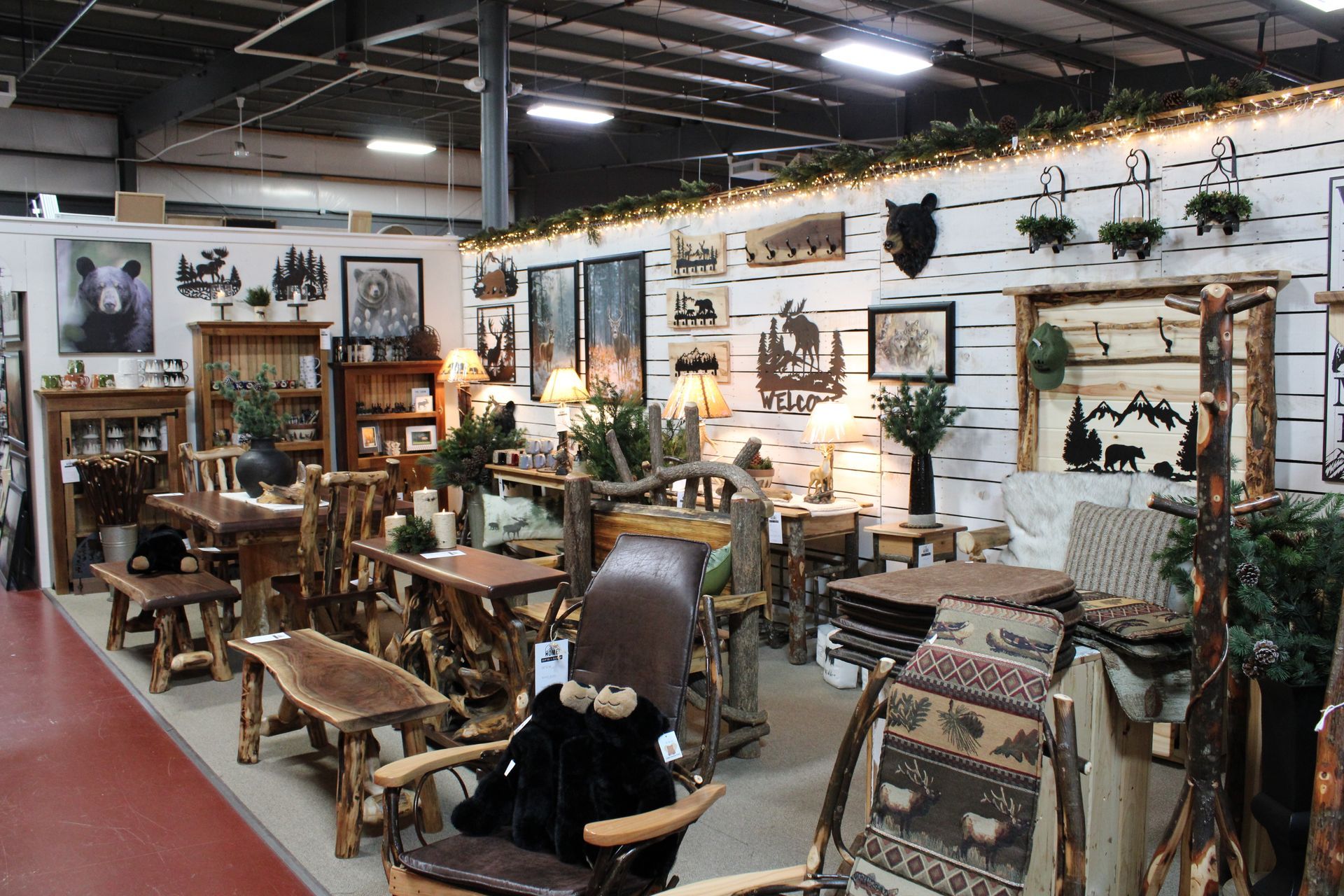 Cozy interior with fireplace, brick wall, and bar area. Rustic decor with string lights and shelves.